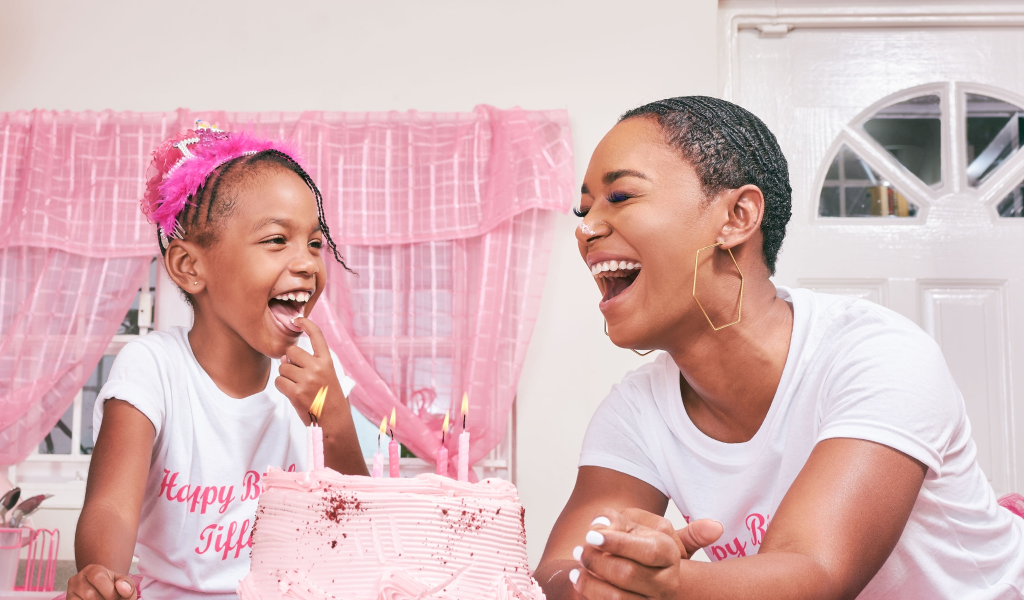 african american mother and daughter laughing